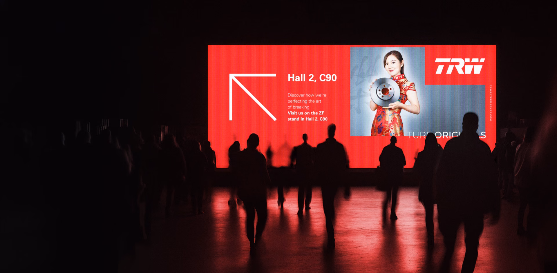 TRW exhibition campaign displayed at an event venue